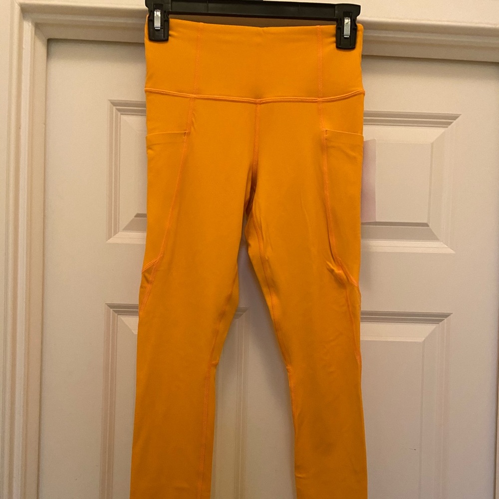 Athleta Stash pocket salutation tights